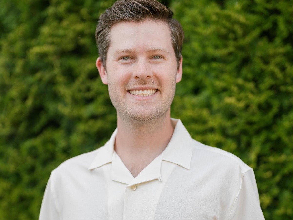 Man in White button-down shirt smiling