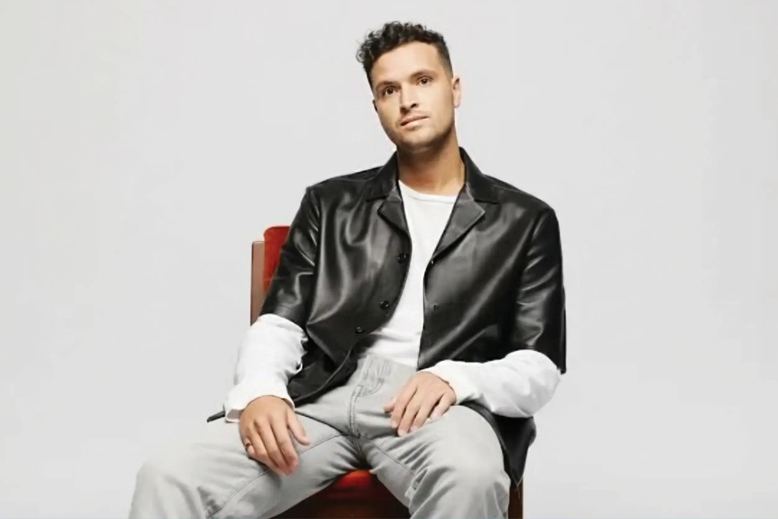 Aodhán King's sitting on a chair