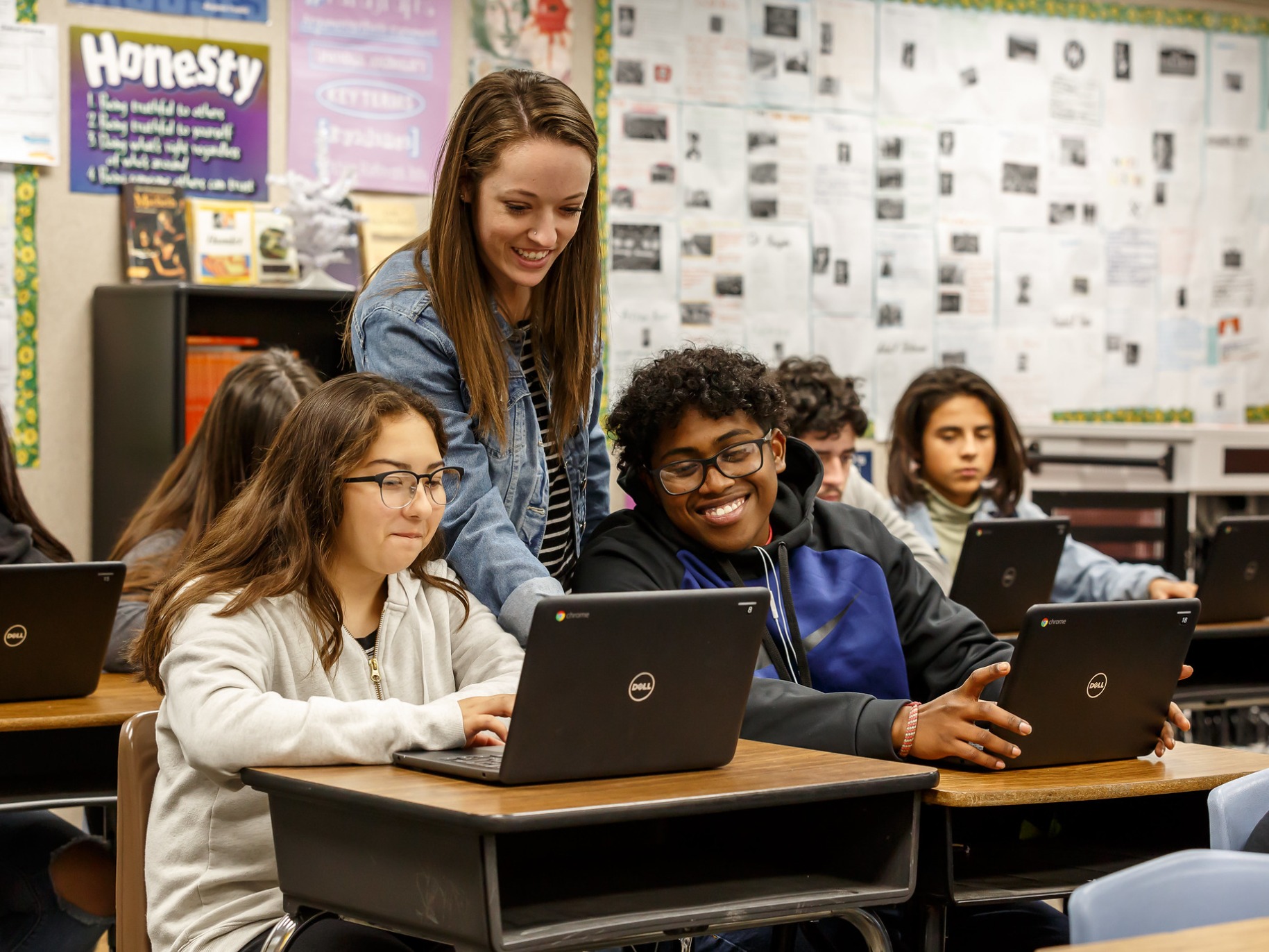 APU student teaches two middle school students in a classroom