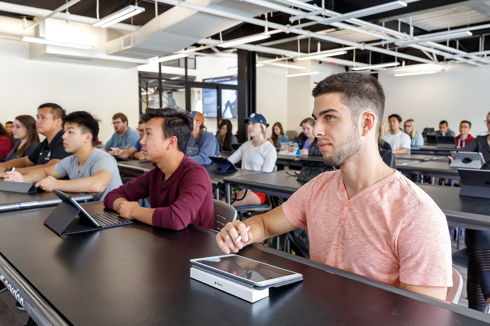 students in classroom listening to the instructor