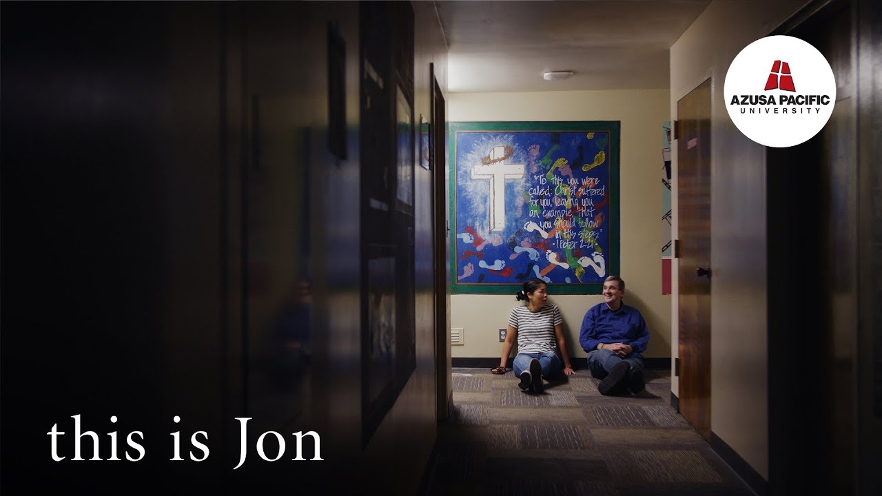 Jon sitting in dorm hallway