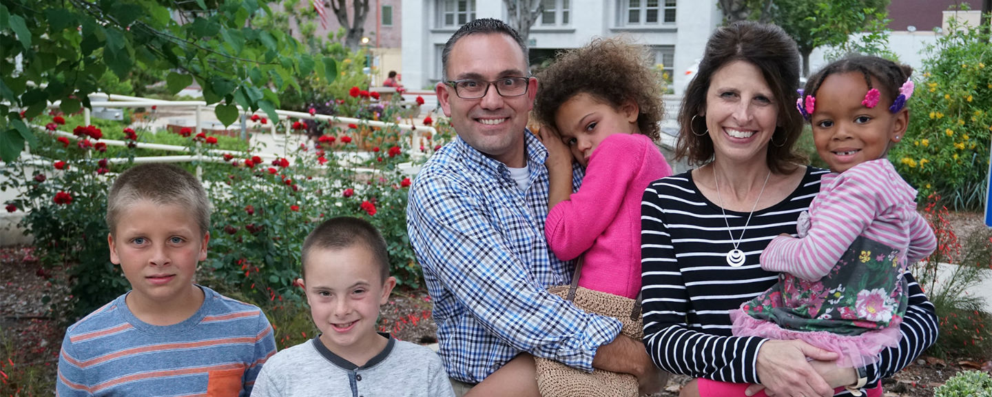 Bobby Duke smiling with his family