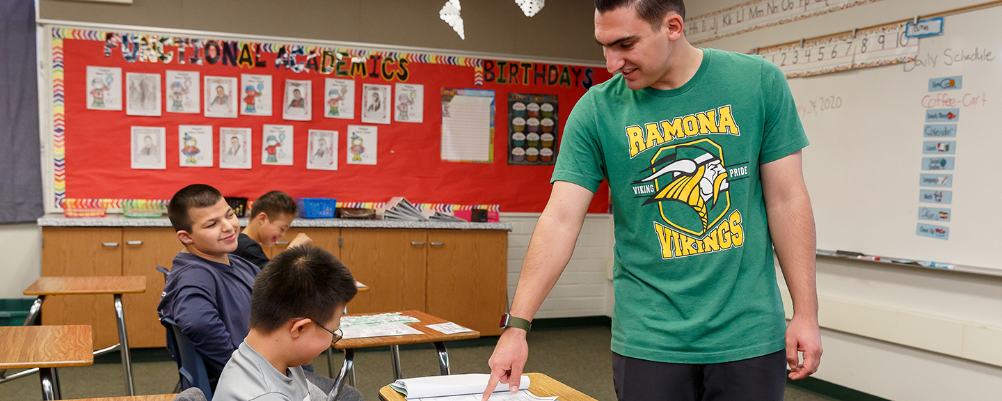 Teacher and student in classroom