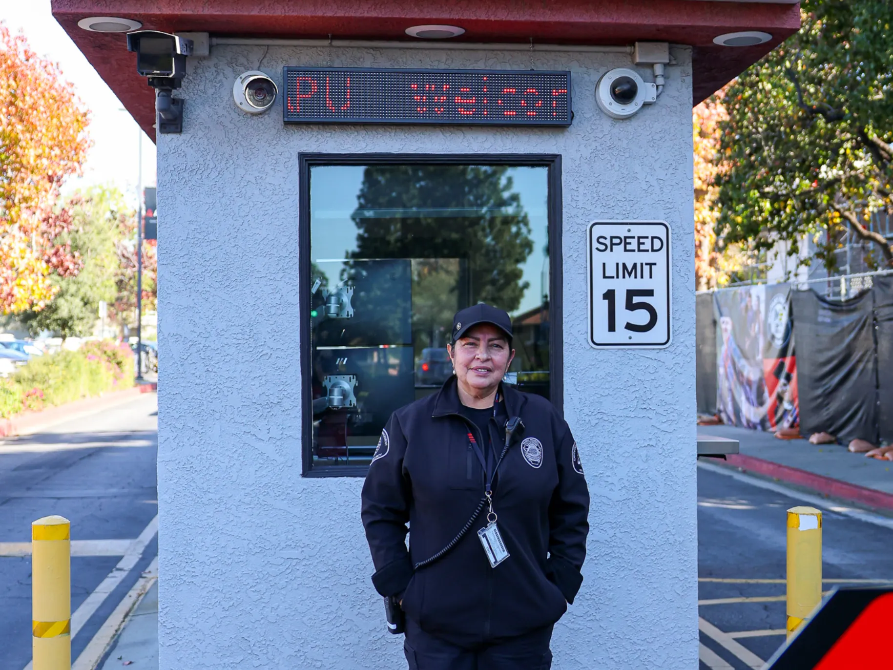 Campus Safety officer standing in front of parking kiosk