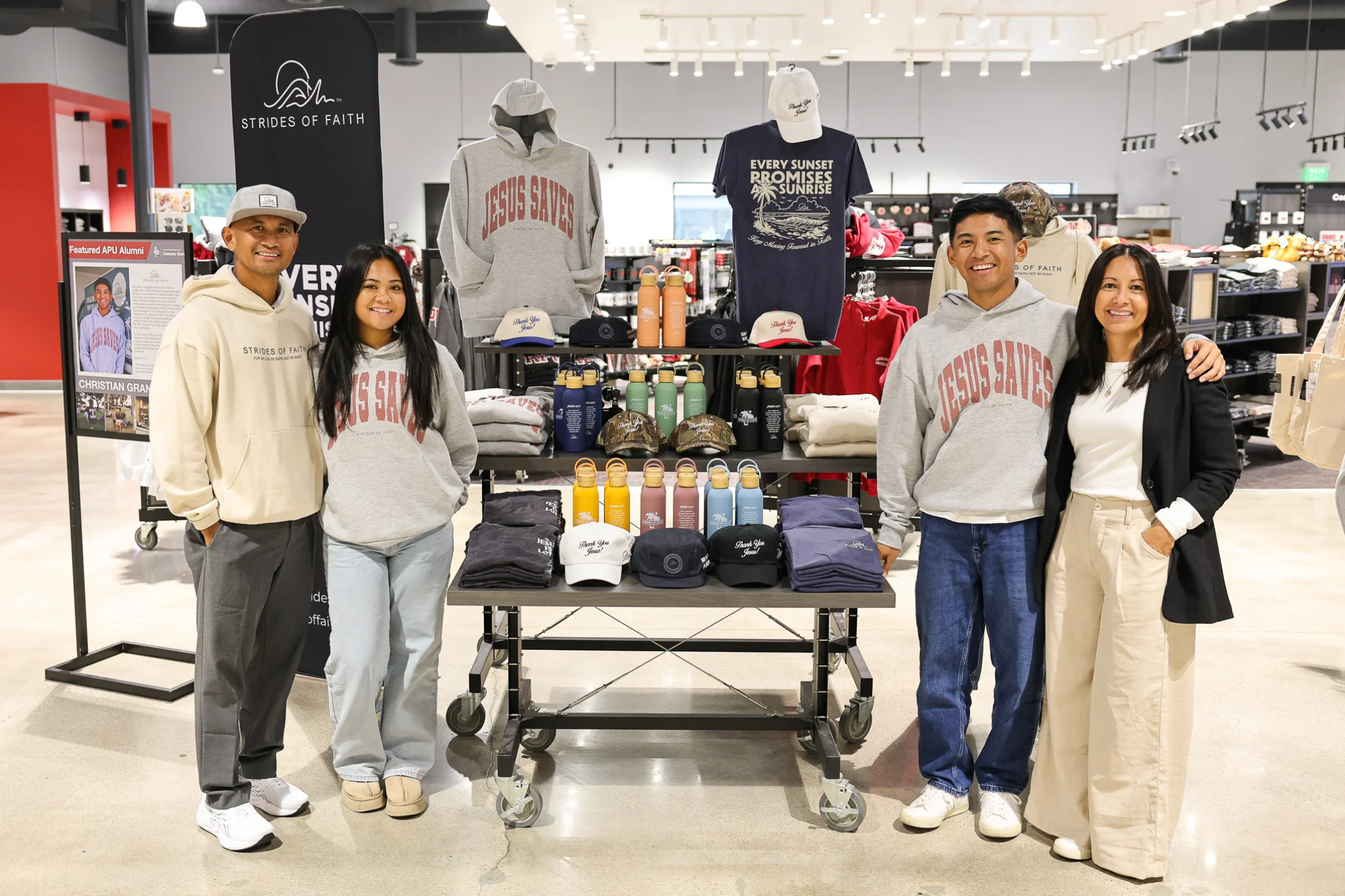 Christian Granadosin and family standing by their merchandise in APU Campus Store.