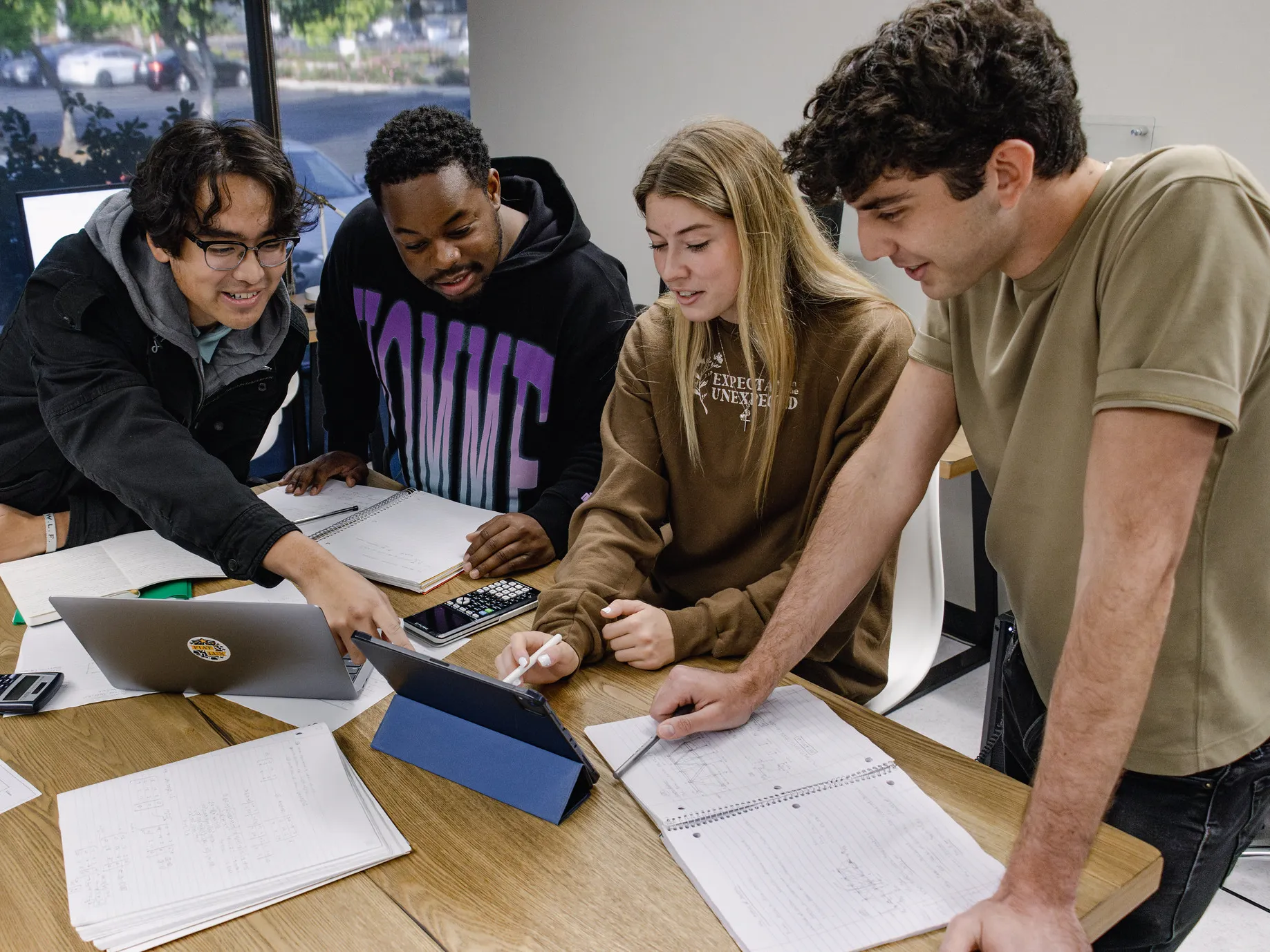 A group of students work on a project together