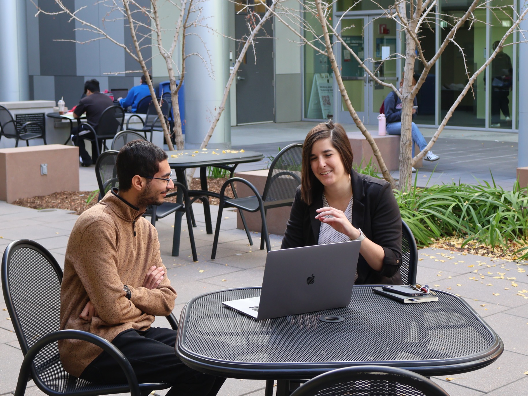 Katie Fitzgerald discusses research with student worker