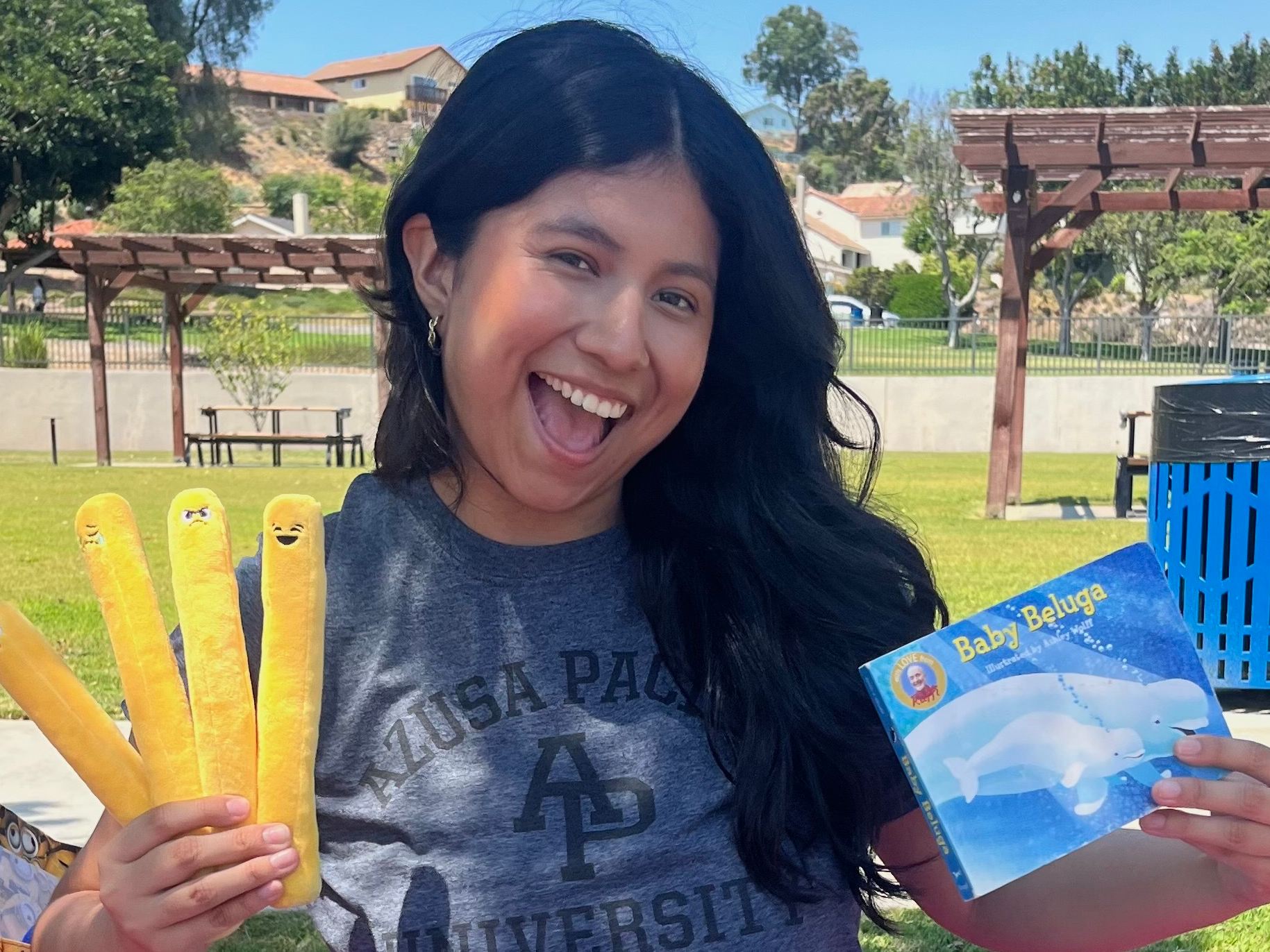 Stephanee Sanchez with some of the toys and books she uses during visits with families.