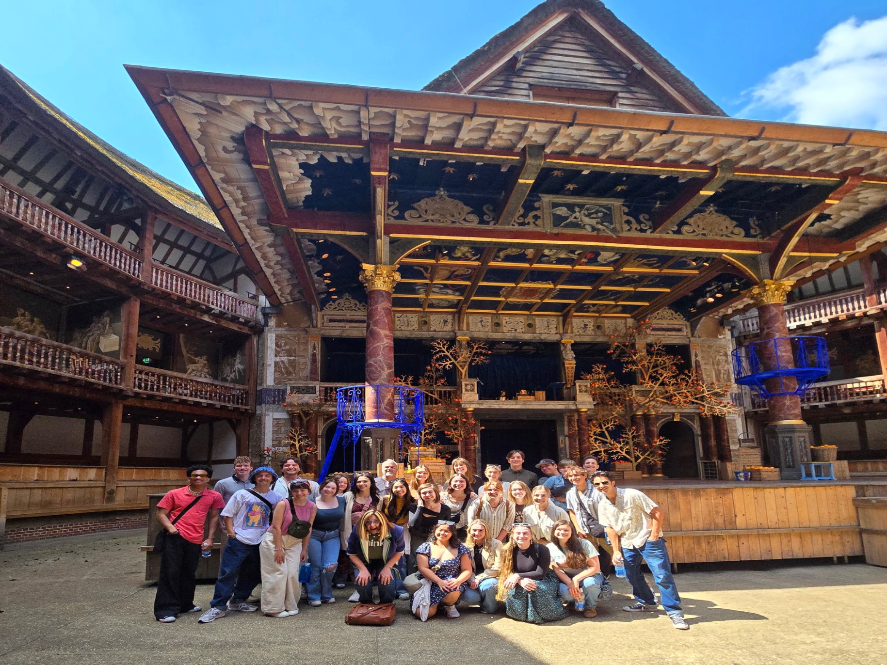 theater arts students smile outside Shakespeare's globe theater