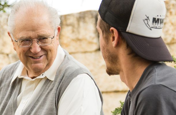 john talking with a student