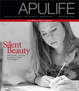 APULIFE front cover of student writing on paper