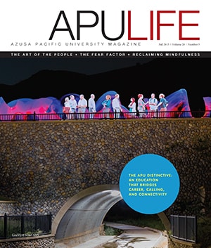 APULIFE front cover of faculty discussing atop a bridge
