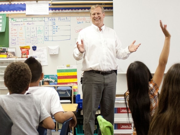 professor teaching kids in classroom