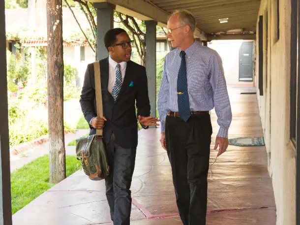 professor talking to student at east campus