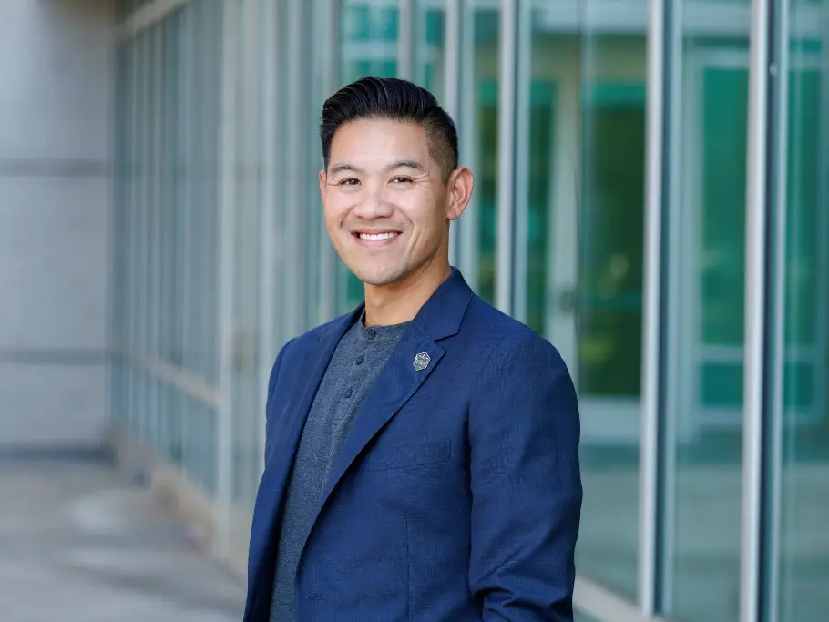 Steve Dang smiles for a Board of Trustees photo