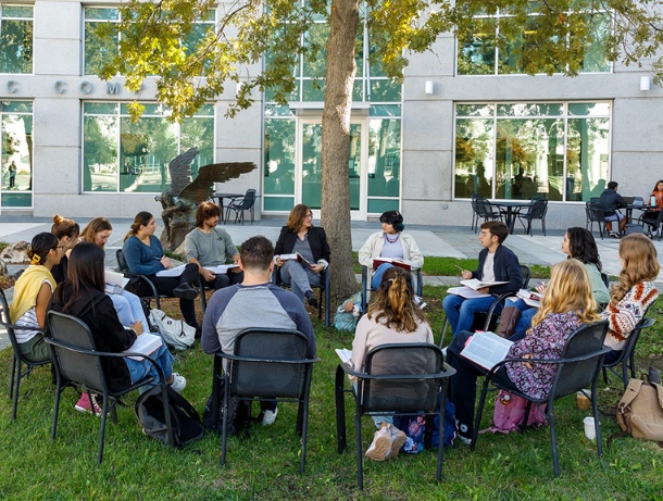 students having a class activity outside