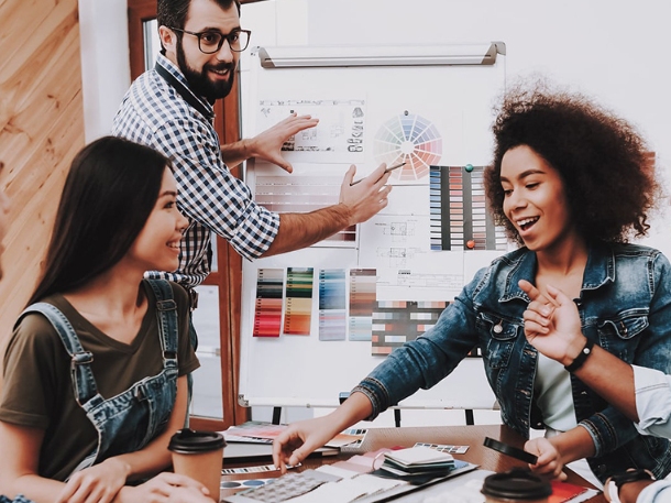 people smiling during a meeting while making decisions