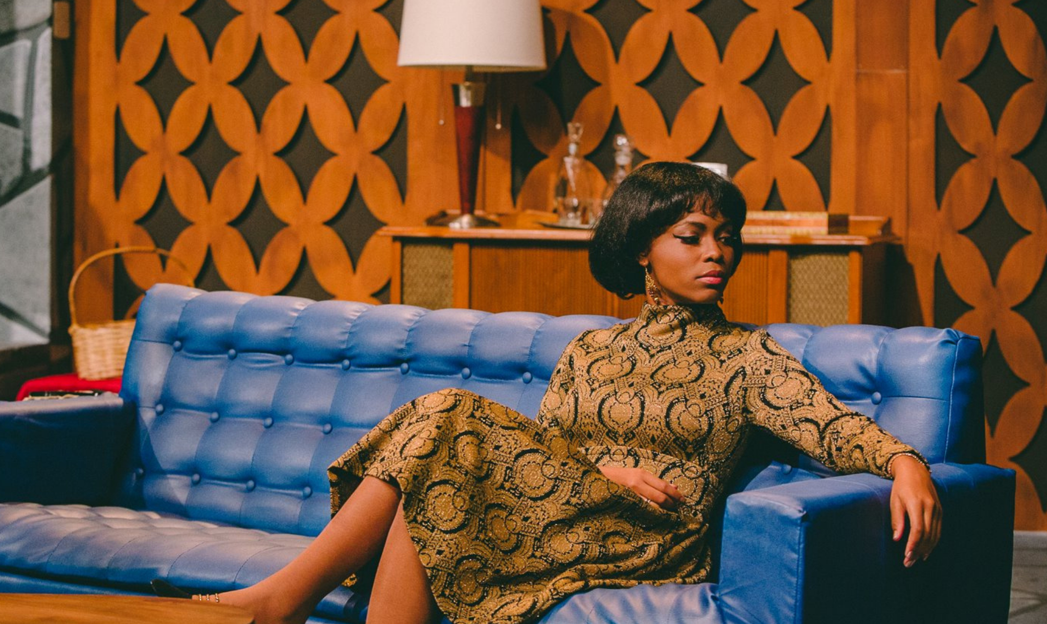 An African American woman sitting on a couch