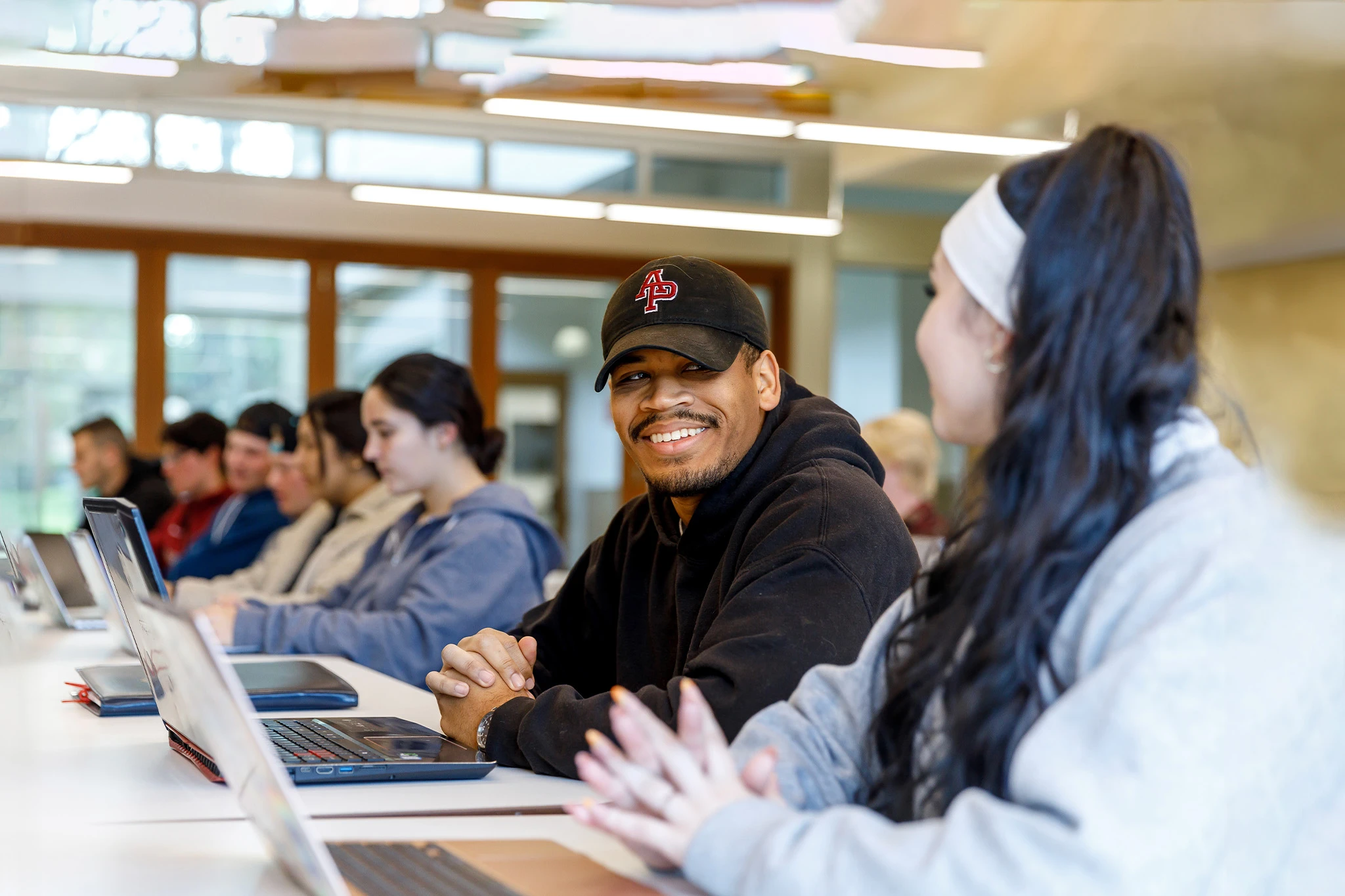 student using his laptop in class