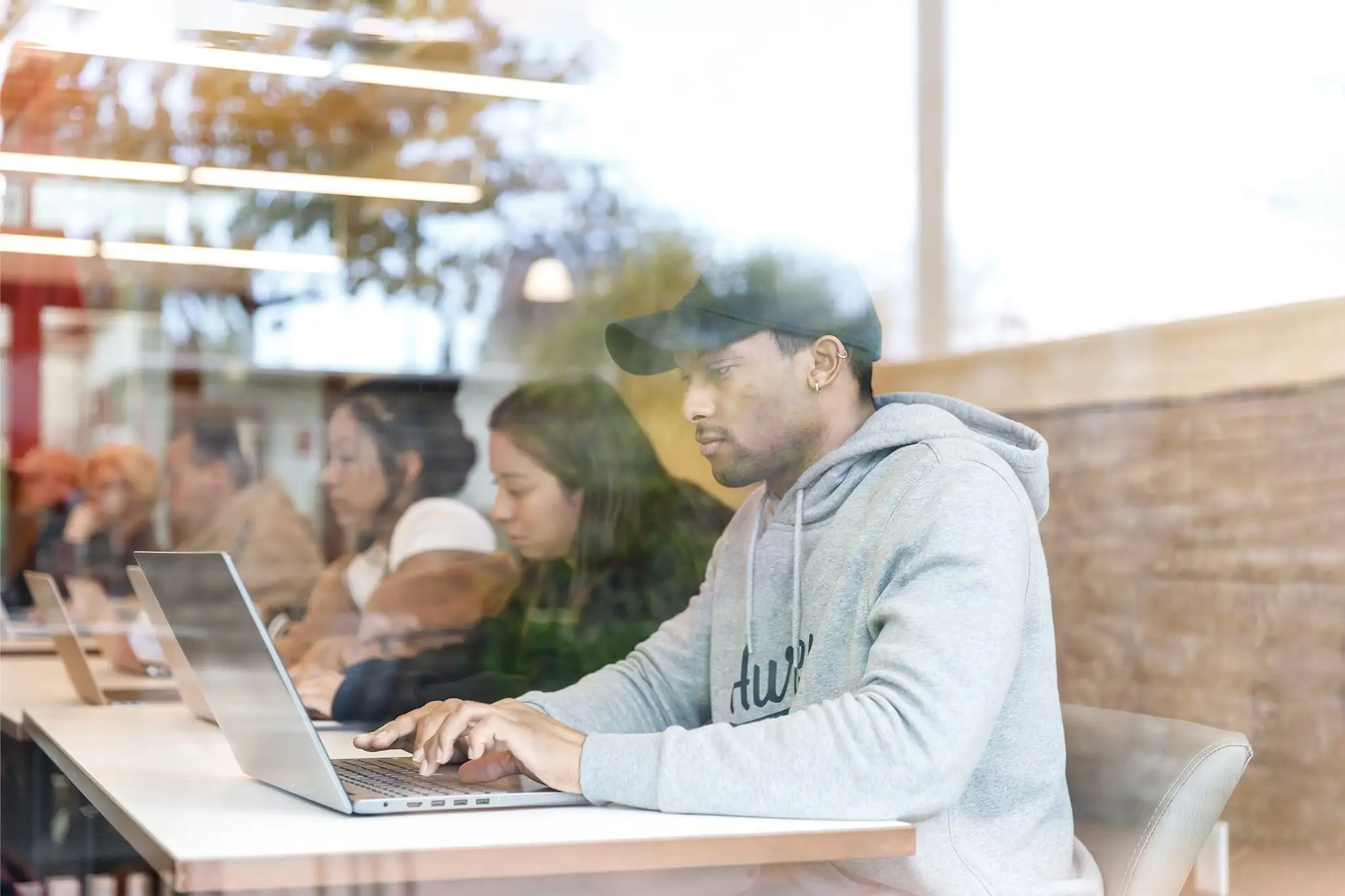 student using his laptop in class