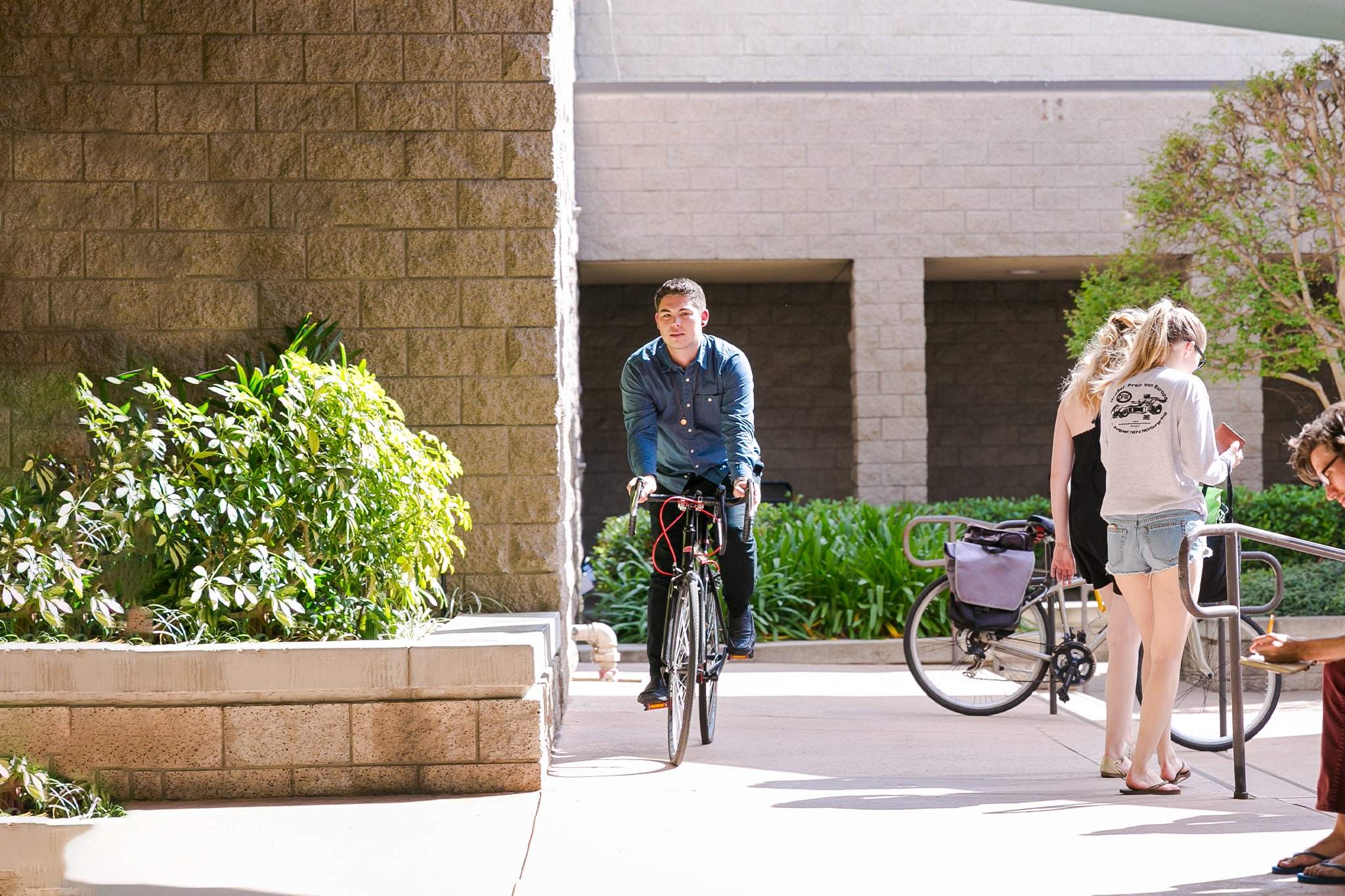 Image of a student riding his bike