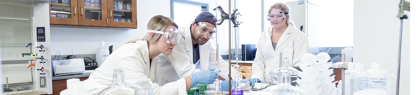 Students in lab coats in a laboratory
