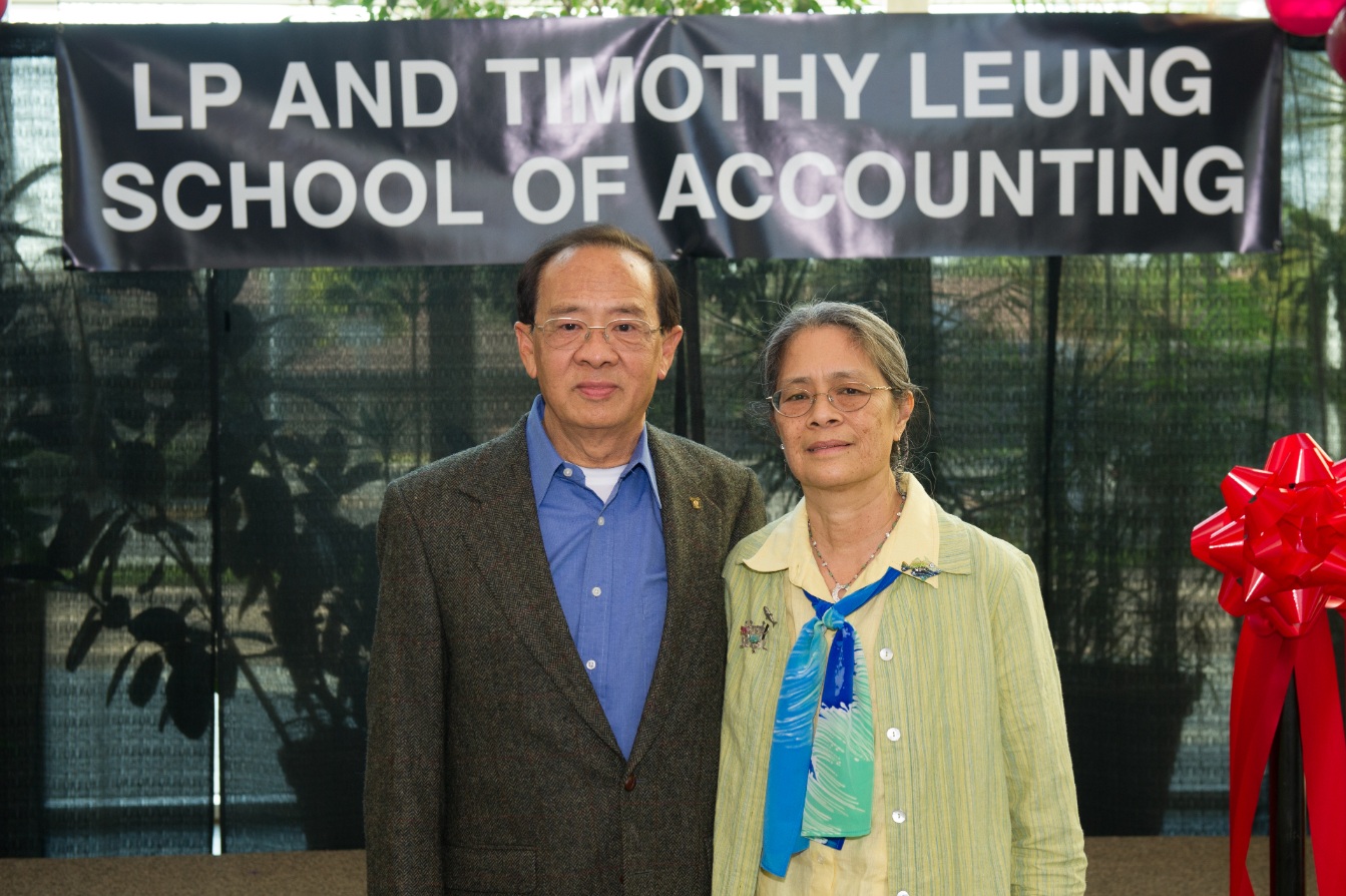 Leung and his wife in front of the LP and Timothy Leung School of Accouting building
