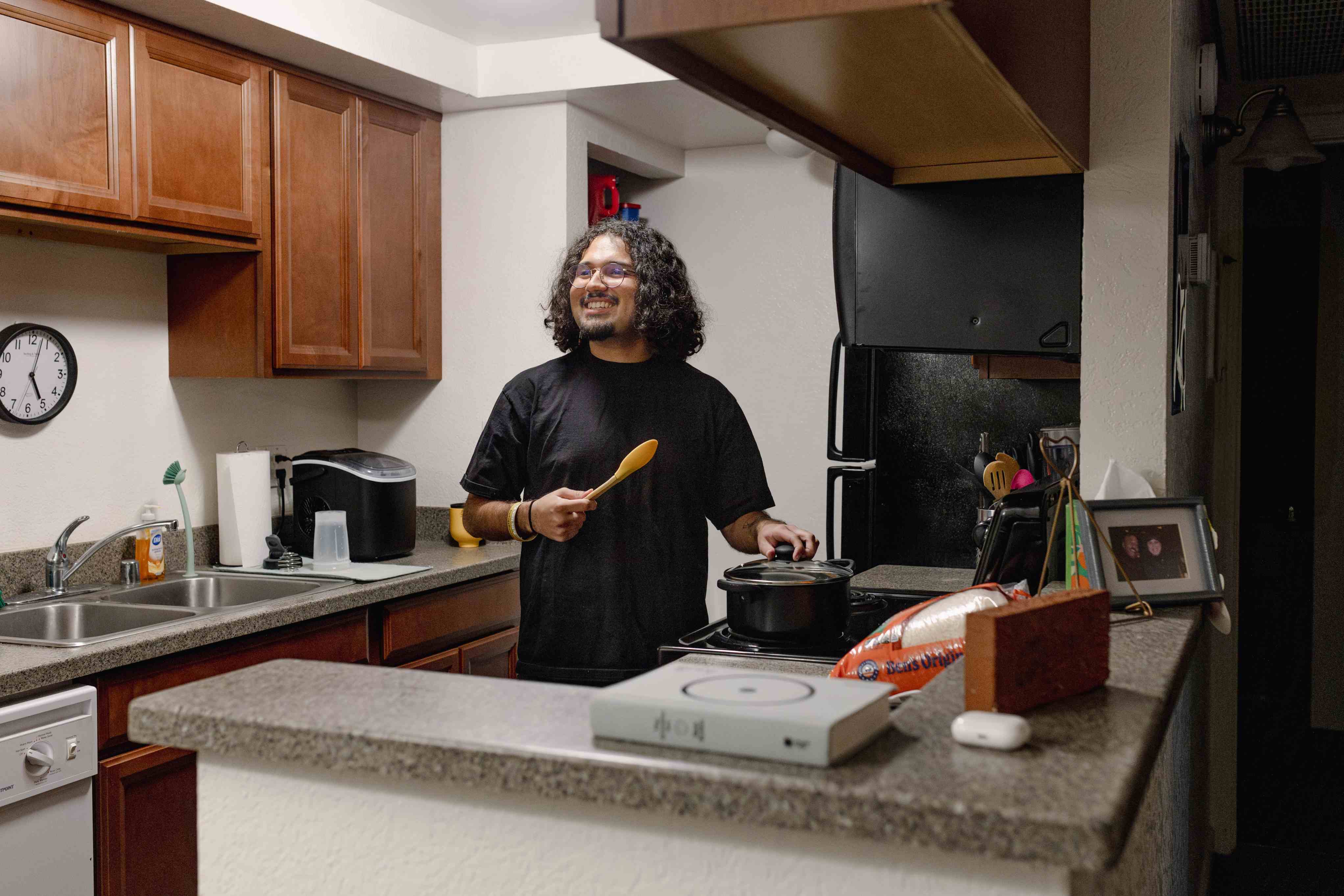 student smiling in the kitchen