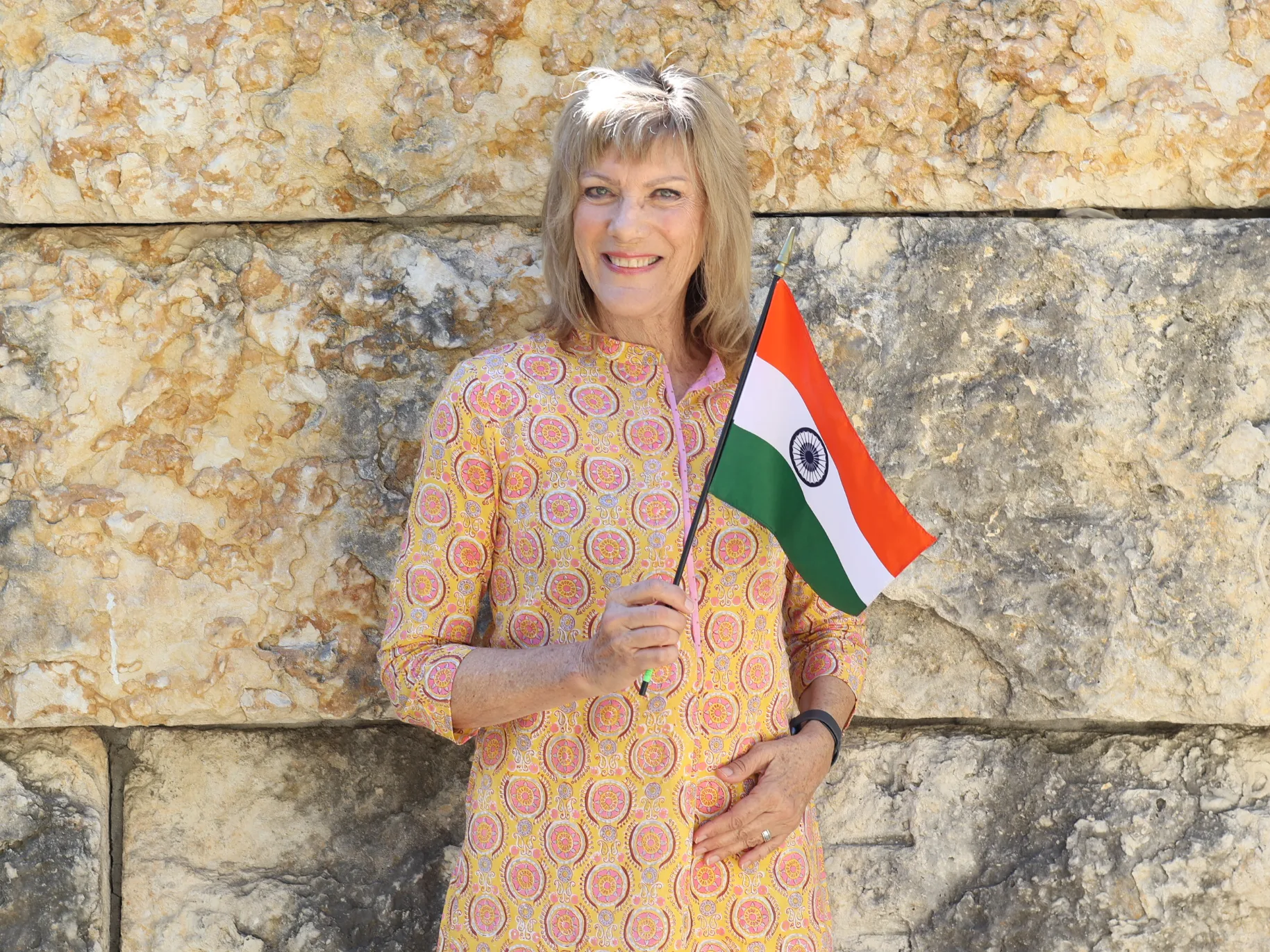 Catherine Heinlein holds India's flag.