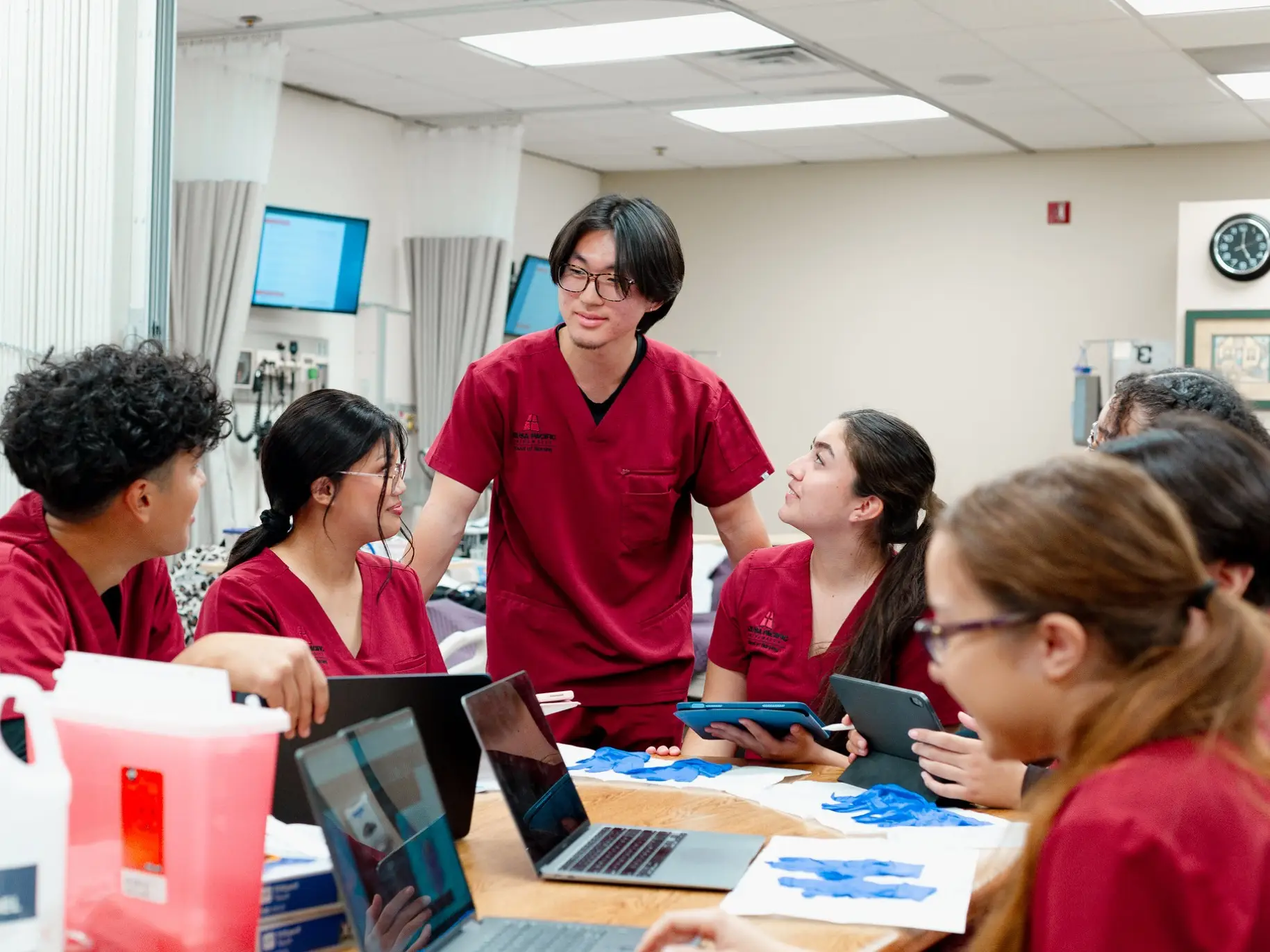 A group of nursing students works on a project together.