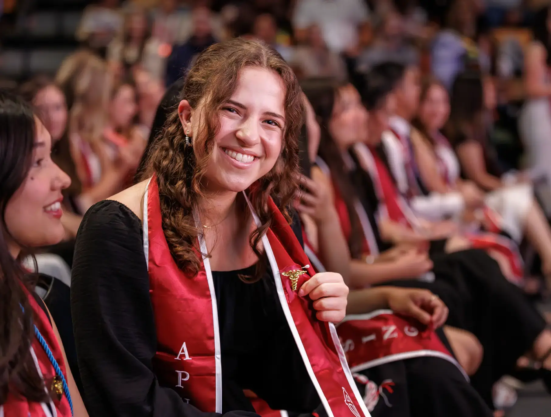 student smiling during commencement