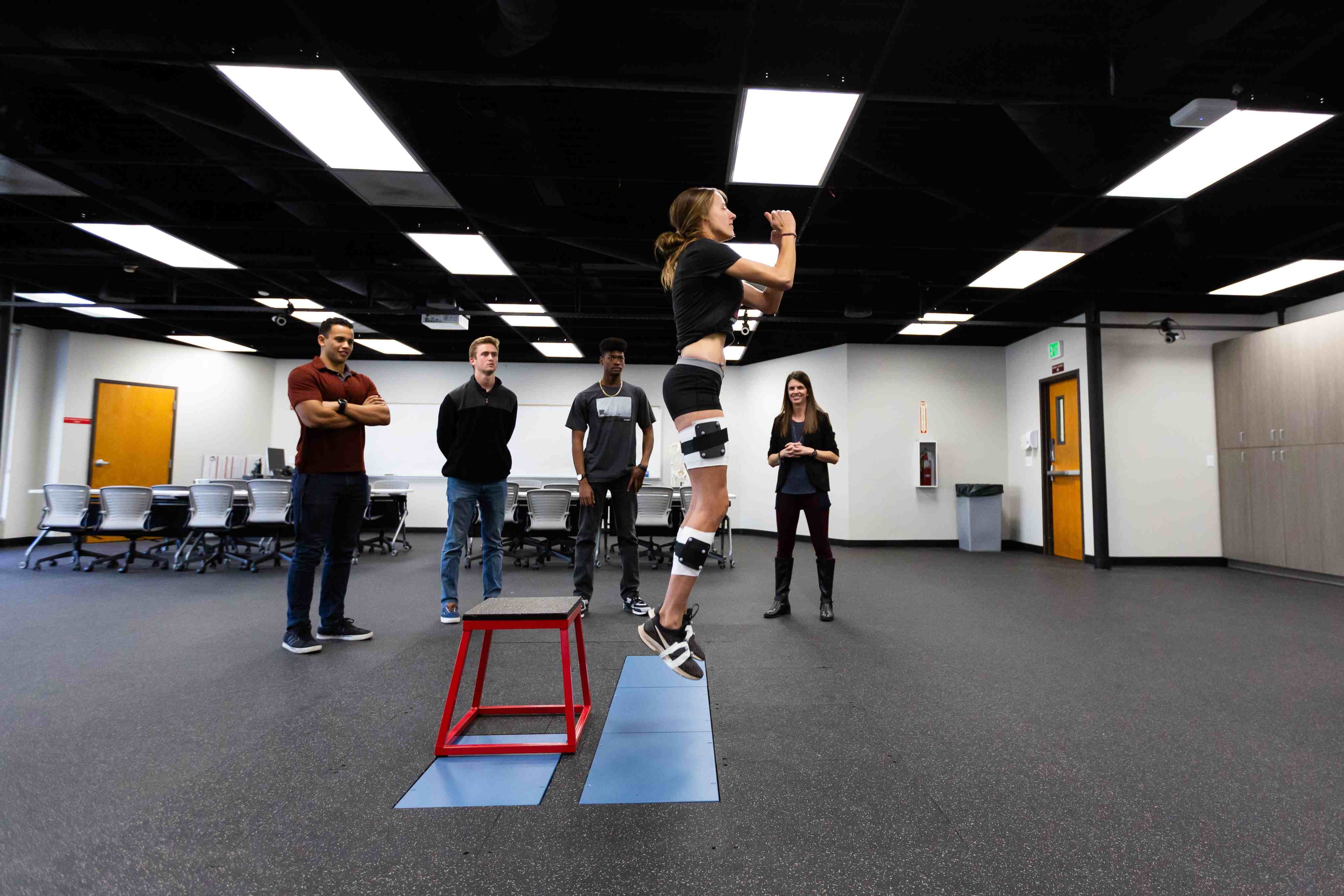 Woman doing rehabilitation by jumping