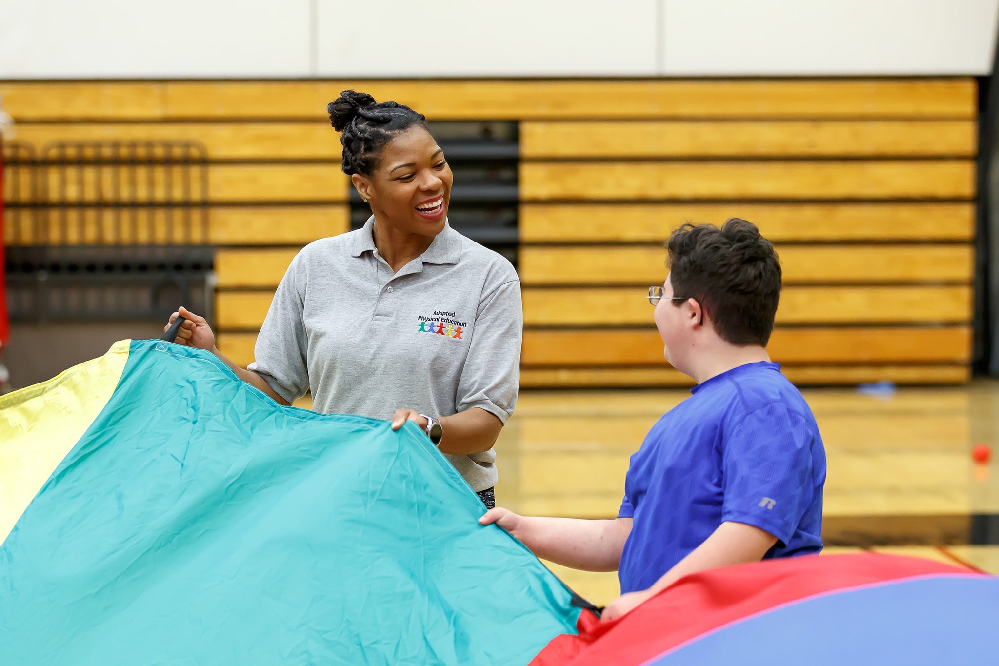 instructor smiling with students during class