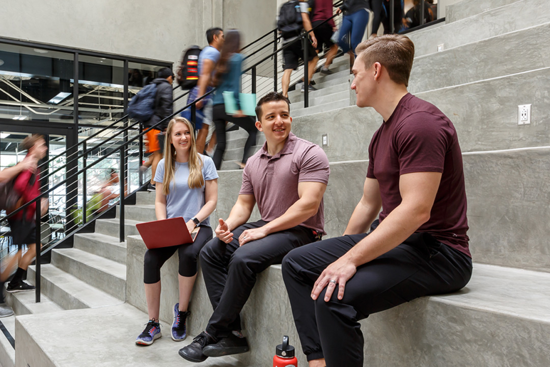 students smiling at west campus