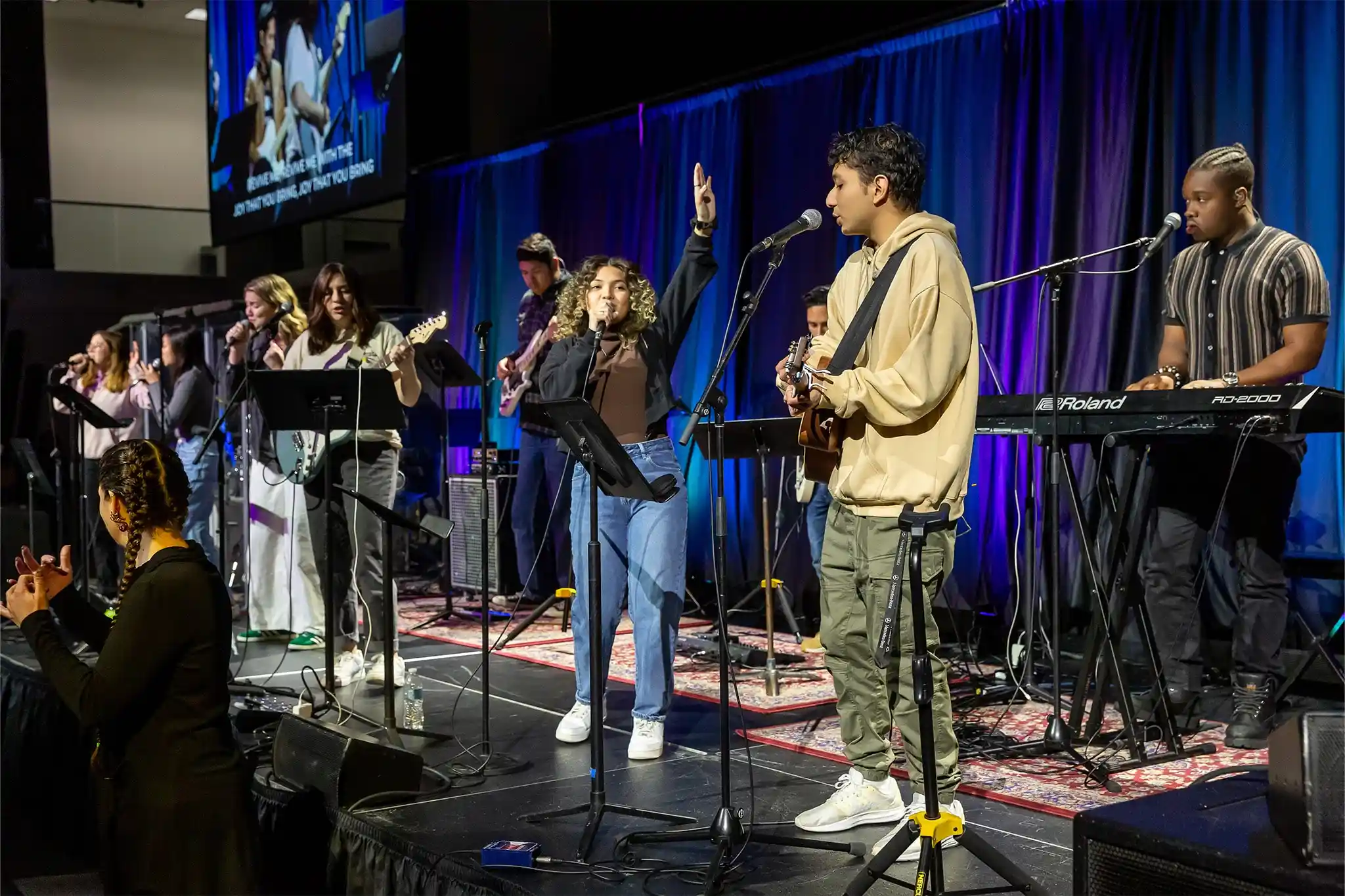 student praying in chapel
