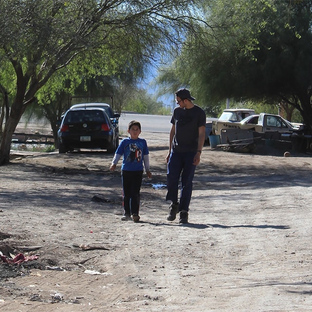 Gabriel walking with a child