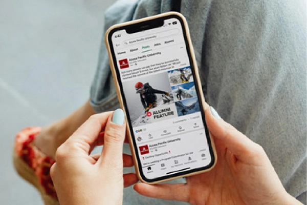 woman holding a iphone device display its screen