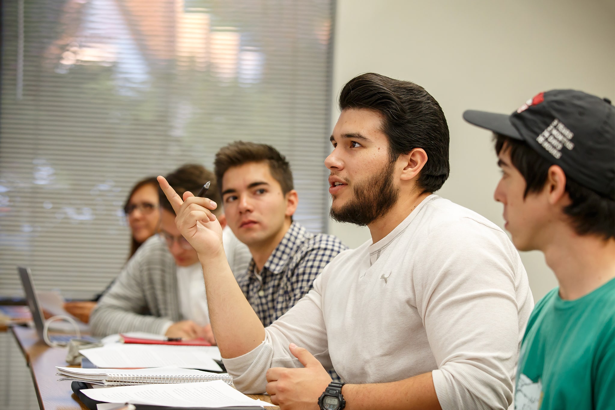 Student asking a question in classroom